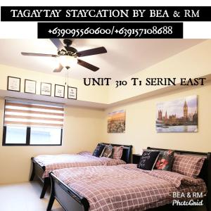Кровать или кровати в номере Tagaytay Serin by Bea and RM