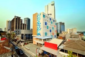 a city with tall buildings and a building at Dafam Express Jaksa Jakarta in Jakarta