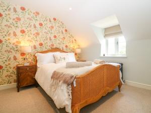 Ένα ή περισσότερα κρεβάτια σε δωμάτιο στο Easter Cottage