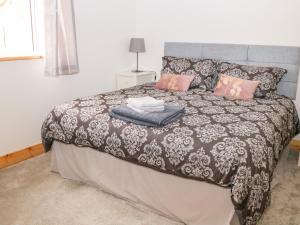 Postel nebo postele na pokoji v ubytování Mandarin Cottage