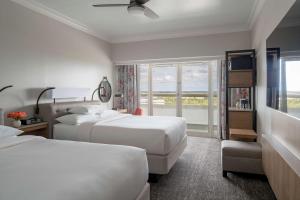 a hotel room with two beds and a window at Hyatt Regency Orlando International Airport Hotel in Orlando