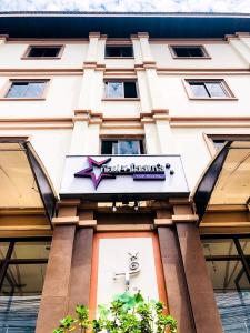 a hotel sign on the front of a building at Top Hostel (Top Mansion) in Udon Thani