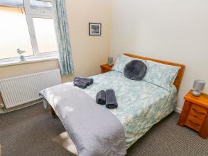 מיטה או מיטות בחדר ב-1 Homecroft Bungalows