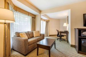 a living room with a couch and a table at Quality Inn & Suites in Brampton