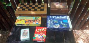 a group of games sitting on top of a table at Alcove Bungalow in Hinkong