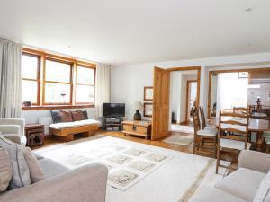 a living room with a couch and a table at Cardean Mill in Blairgowrie