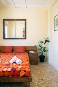 A bed or beds in a room at Mosaics aprtm in the Historical centre with Acropolis view