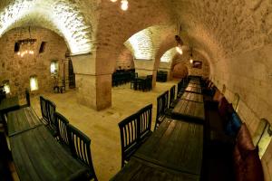 a group of wooden benches in a building at HANEHAN in Urfa
