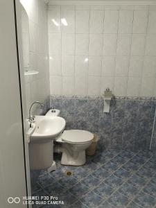 a bathroom with a toilet and a sink at Hotel Belisimo in Ruse +46 photos