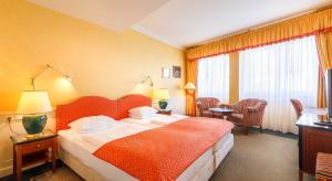 Postel nebo postele na pokoji v ubytování Dvorak Spa & Wellness