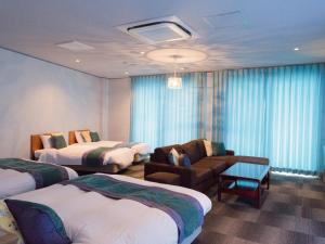 Postel nebo postele na pokoji v ubytování Hotel Caretta