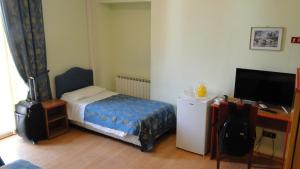 Postel nebo postele na pokoji v ubytování Hotel Altavilla Dieci