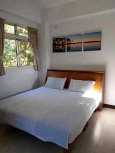 Postel nebo postele na pokoji v ubytování Shan Hu Lian Homestay + 37 fotografií