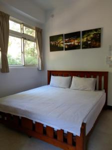 Postel nebo postele na pokoji v ubytování Shan Hu Lian Homestay