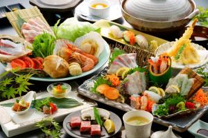 a variety of food is displayed on a table at Tenku Yubo Seikaiso in Beppu