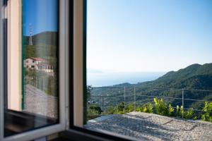a window with a view of a mountain at Il Leccio - Luxury Resort Portofino Monte in Santa Margherita Ligure