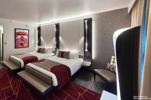 Llit o llits en una habitació de Disney Hotel New York - The Art of Marvel