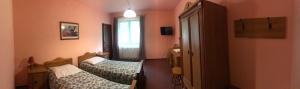Posteľ alebo postele v izbe v ubytovaní Hotel Twardowski