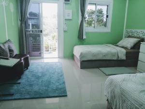 Ein Bett oder Betten in einem Zimmer der Unterkunft Ban Ing Suan