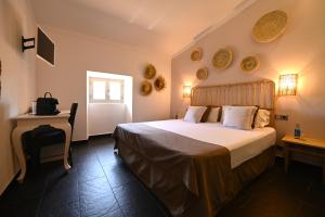 Postel nebo postele na pokoji v ubytování Stadthotel Santanyi
