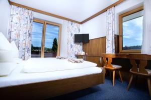 Letto o letti in una camera di Berghof Mitterberg