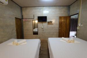 Letto o letti in una camera di Baan Khue Wieng Resort