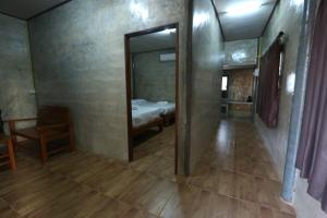 Letto o letti in una camera di Baan Khue Wieng Resort
