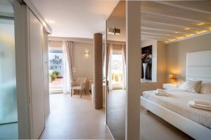 a bedroom with a bed and a view of a room at Covo dei Saraceni in Polignano a Mare