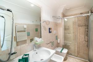 a bathroom with a sink and a shower at Covo dei Saraceni in Polignano a Mare