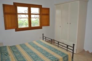 A bed or beds in a room at Residence Le Zagare