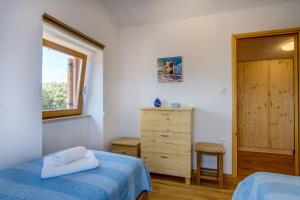 Llit o llits en una habitació de Holiday home Verin