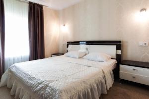 Postel nebo postele na pokoji v ubytování Noy Hotel