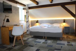 Säng eller sängar i ett rum på Hotel Miriquidi
