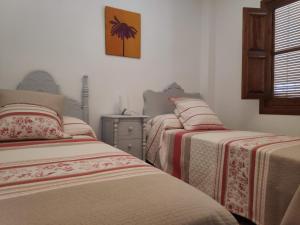 A bed or beds in a room at Cortijo El Arrejadero