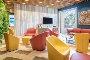 TV a/nebo společenská místnost v ubytování Aparthotel Adagio Rome Vatican