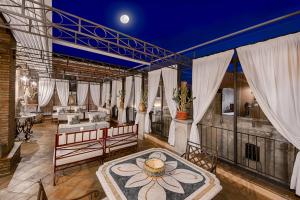 a living room with a large room with curtains and a rug at Relais 147 - Luxury b&b in Taormina