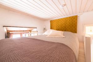 Cama ou camas em um quarto em Bohemian Antique Guesthouse