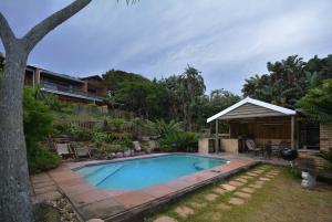 a swimming pool in the yard of a house at IRONWOOD LODGE in Pennington