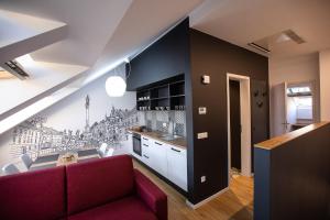 A kitchen or kitchenette at Postcard City Apartments
