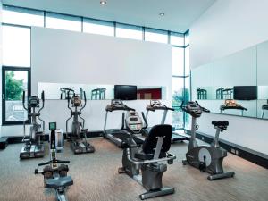 a gym with several treadmills and elliptical machines at Park Inn by Radisson Aberdeen in Aberdeen