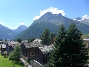 a view of a village with mountains in the background at Apartment Acimo by Interhome in Saas-Fee