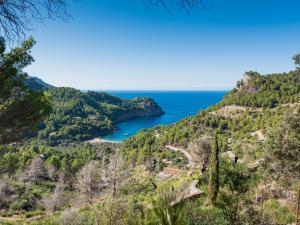 a view of the ocean from the hills at Holiday Home Cala Tuent by Interhome in Cala Tuent