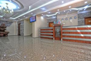 a large room with a lobby with a chandelier at VIARDO Hotel in Tashkent +28 photos