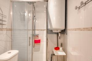 a bathroom with a shower and a toilet and a sink at Crew Lighthouse in Antibes