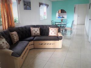 a living room with a couch and a table at CASA MARLE in Boquete