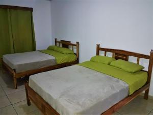 Tempat tidur dalam kamar di CASA MARLE