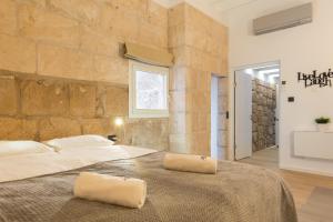 Postel nebo postele na pokoji v ubytování studio cave