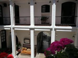 Un balcón o terraza de El Hotel de Su Merced