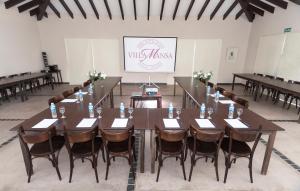 a conference room with a long table and chairs at Villa Mansa in Vistalba +37 photos