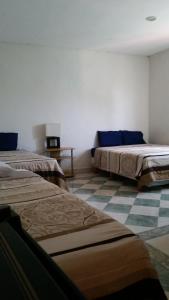 Postel nebo postele na pokoji v ubytování Yucatan Vista Inn Guest House
